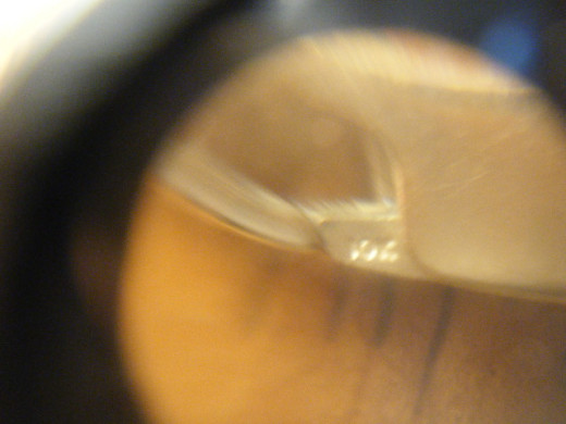 Use a jewelers loupe to check markings.
