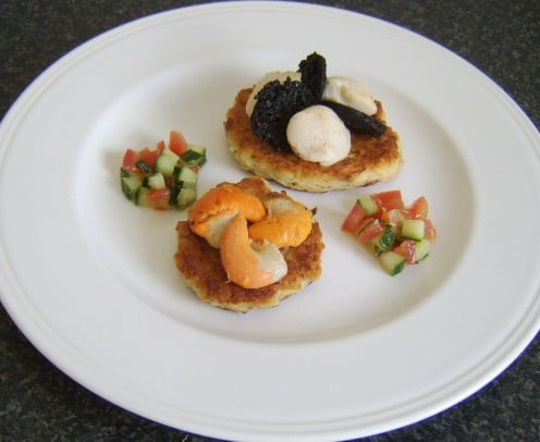 Pan seared king scallops, served with black pudding on potato cakes