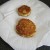 Potato cakes are drained on kitchen paper