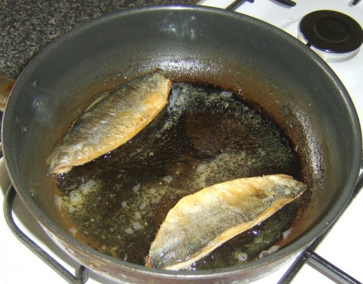 Herring fillets complete cooking on their flesh sides