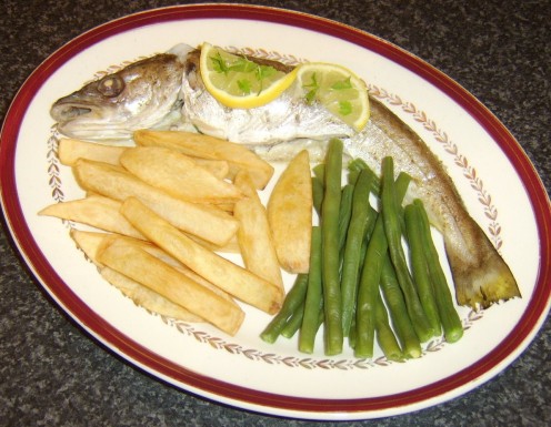 Whole baked whiting, served with homemade chips and trimmed green beans