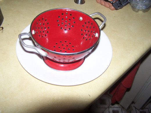 Colander to drain excess grease from the bacon bits.