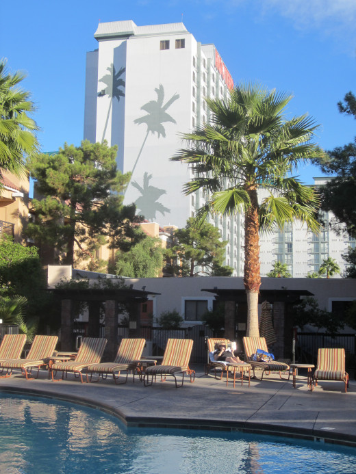 Swimming Pool at Desert Rose Resort in Las Vegas with Hooters Hotel and Casino in the background.