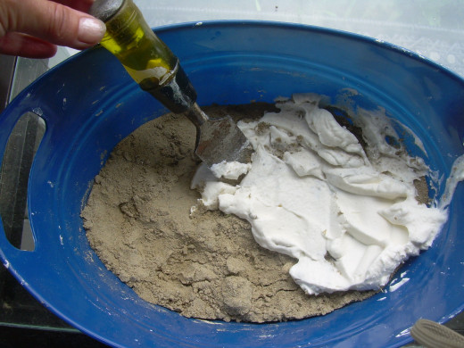 Pouring plaster over the surface of the sand
