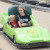 A young boy rides with his mother