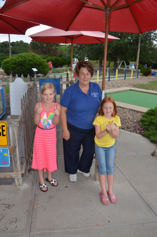 Our girls with Margaret White, Owner of Papio Fun Park.  The girls rate the park with 2 thumbs up!