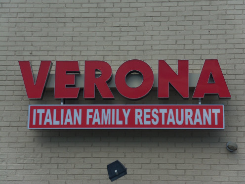These photos are what the side of the restaurant looks like now, and were taken in August of 2013. They could have still in some way incorporated the student's artwork with the new pizza restaurant's sign, but it's a little late for that now.