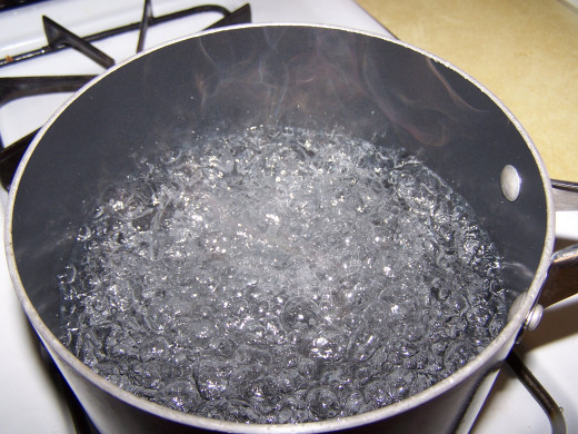 Pot of boiling water to cook the eggs in.