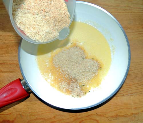 add mix of Panko and Progresso breadcrumbs to melted butter, and stir