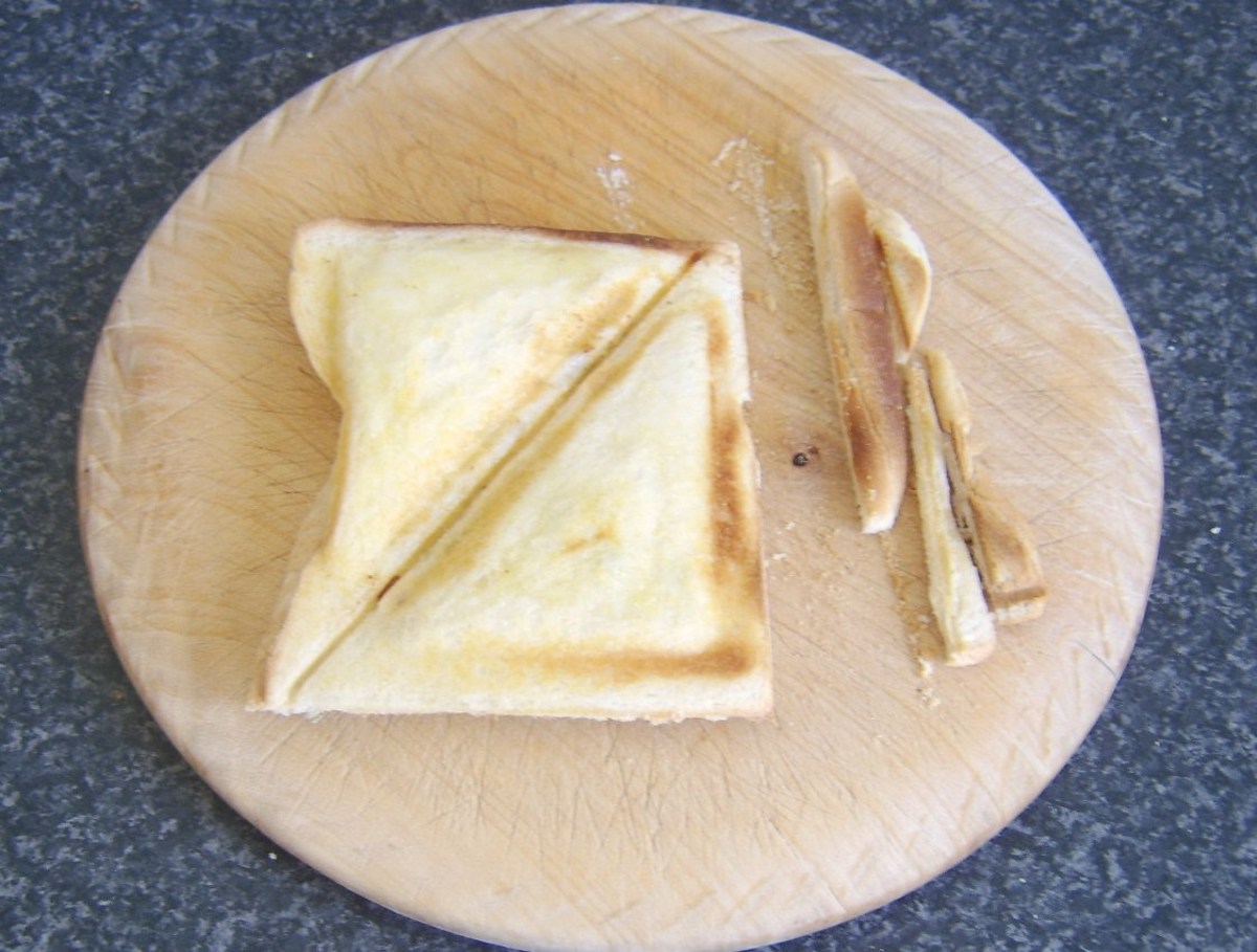 Cooked toastie is trimmed for serving