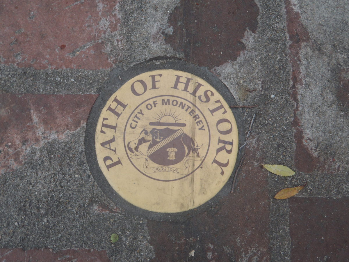 The gold plates mark the history walking tour path in Monterey, California. 