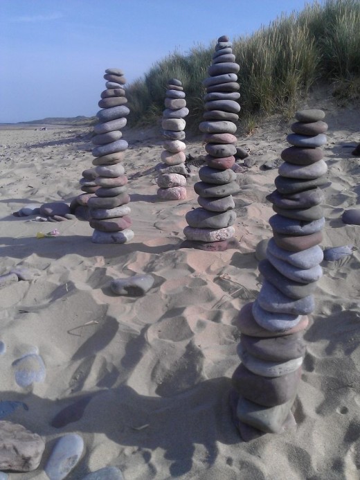 This is my wife's homage to the art of Chris Drury - also on the beach at Rhossili at about 6 in the morning.