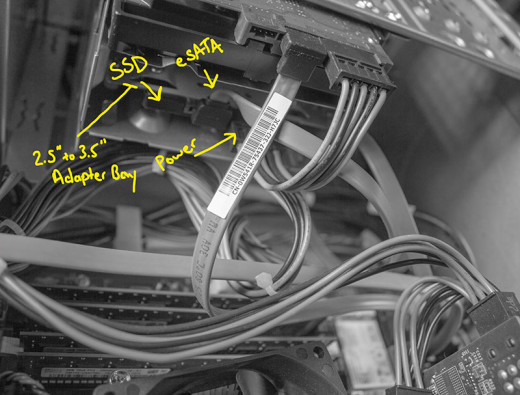 SSD fitted into 3.5" hard drive bay with labels.