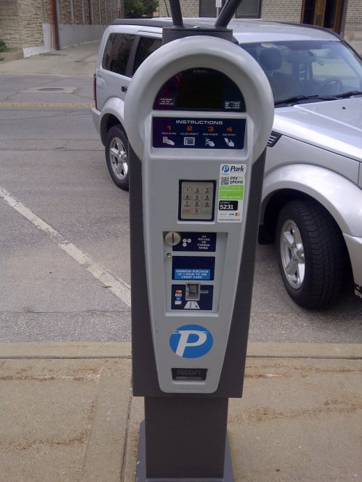 This parking meter takes coins or credit cards
