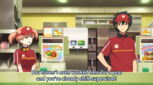 Chiho (left) and Sadao in human form (right) working the counter at MgRonald's.