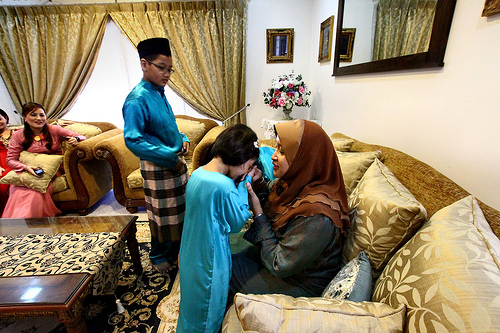 Children seeking forgiveness from their elders - a customary practice during the first day of Hari Raya Puasa