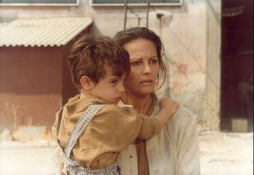 Ida (Claudia Cardinale) with the little Useppe in the Comencini's film (1986).