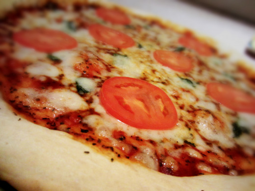 Perfection takes practice, and in my opinion, this pizza recipe is it! Thick crust and tangy tomatoes are the best!