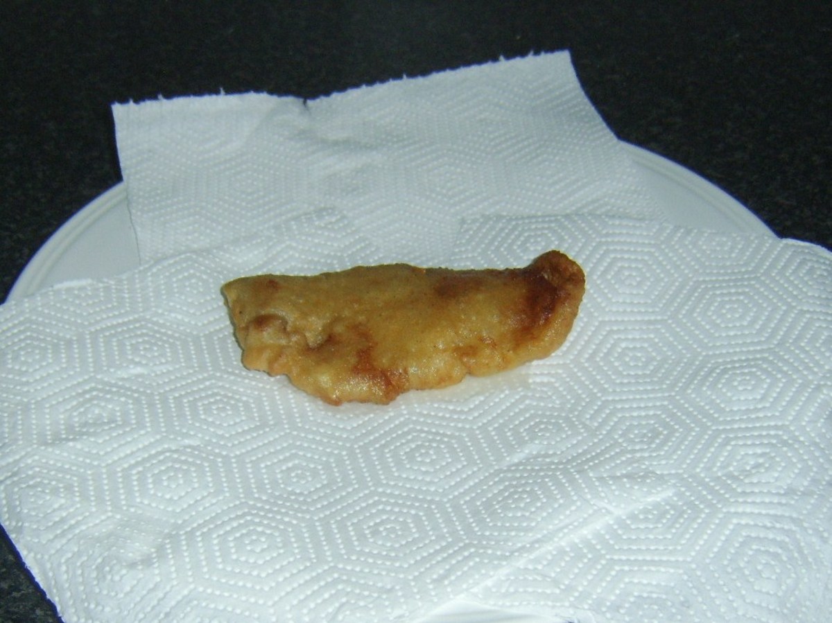 Pollack fillet is drained on kitchen paper