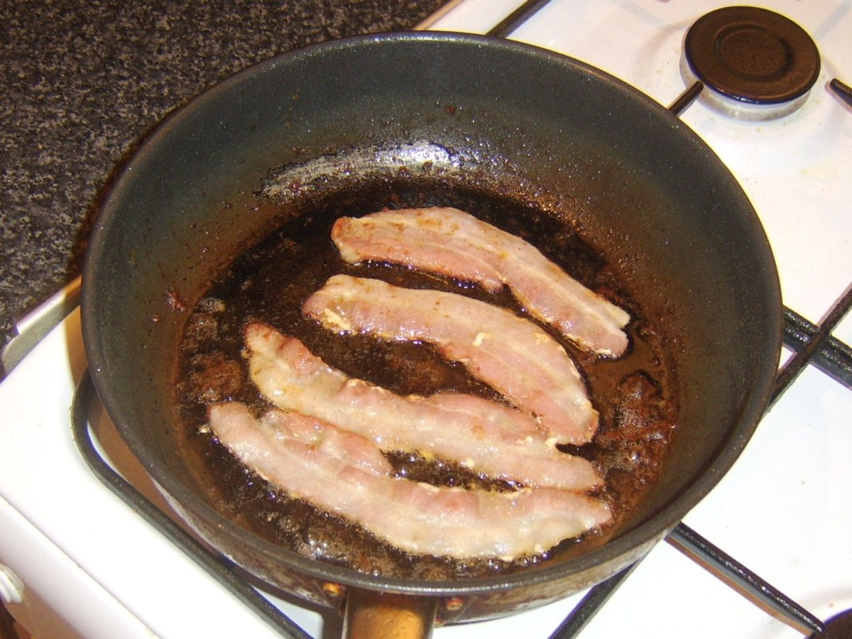 Bacon slices are fried