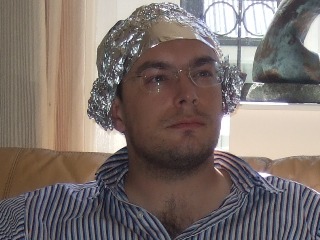 Mr. Are you Finished Yet is not making a fashion statement by wearing this stylish tinfoil hat.  He knows you are part of the conspiracy, and he is trying to keep you from stealing his brain waves.