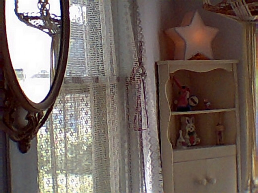 This little corner cabinet, left by a tenant, rounds out this small square room.