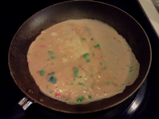 Making rainbow scrambled eggs.