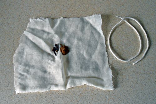 Cut a square of muslin (it doesn't have to be perfect, as you can see!), place spices in the center