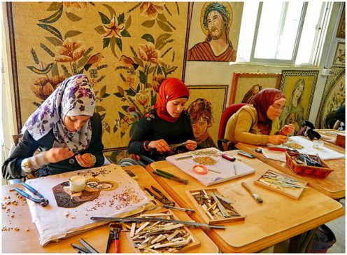 Artisans arranging the mosaic panel 