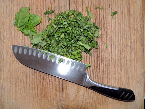 meantime, remove stems and buds from basil, and mince basil leaves