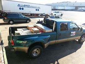 Loading grapes and juice for winemaking. 