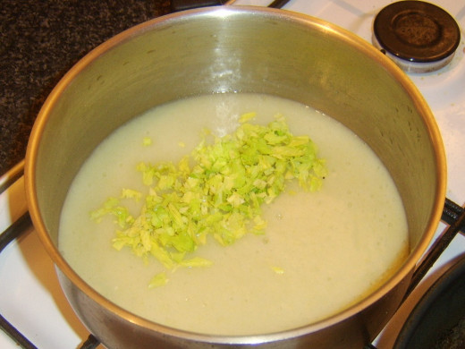 Chopped celery leaves are added to soup
