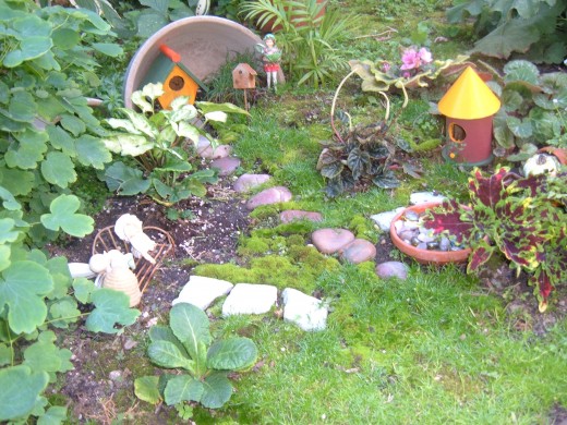 I used my grandmother's stoneware bowl to bake bread for years, but it finally broke. I could not part with it, so it shelters a Fairy house in one of my gardens.