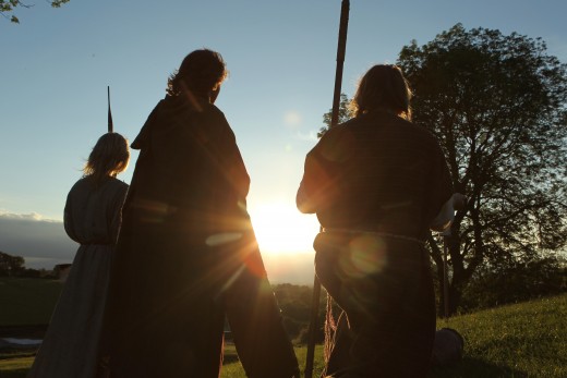 Re-enactors at the Navan Centre near sunset. In engaging to live life as their ancestors knew it, they allow a younger generation an insight into Irish/Gaelic history  