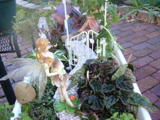 This standing fairy goes well on the path with a taller trellis. It is important to keep the accessories in line with the size of your garden.