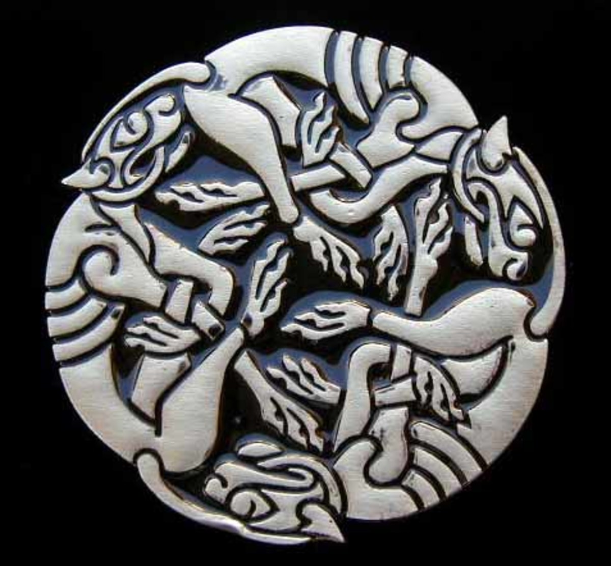 Tail-chaser carving - see the legend of Ioruaidhe or Ruaidhri
