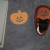 Use a punch to make a Halloween face on the die cut shape.