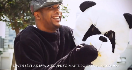 Patrice Wilson, co-founder of Ark Music Factory. No, seriously, he is in a panda costume.