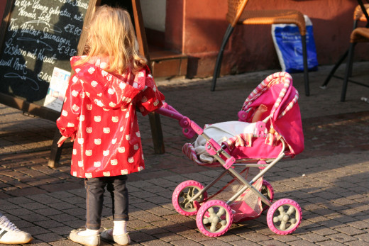 LIttle girl and her 'babe' - on a downtown street in Ettlingen, Germany