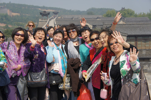 A smiling, happy tour group posing for us near Ping Yao