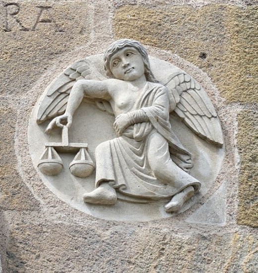 Libra zodiac sign on the Saint-Austremoine Issoire Church facade in Auvergne, France