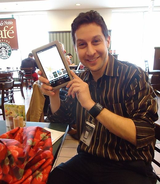 A salesman demonstrates a Nook tablet at Barnes and Noble bookstore. 