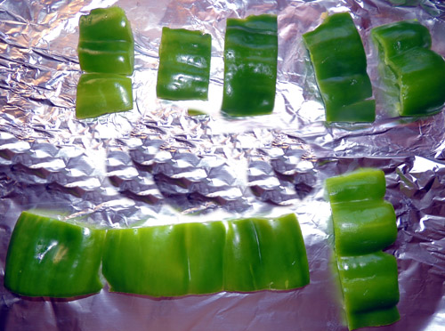 slice, seed, flatten green bell peppers, and place on foil