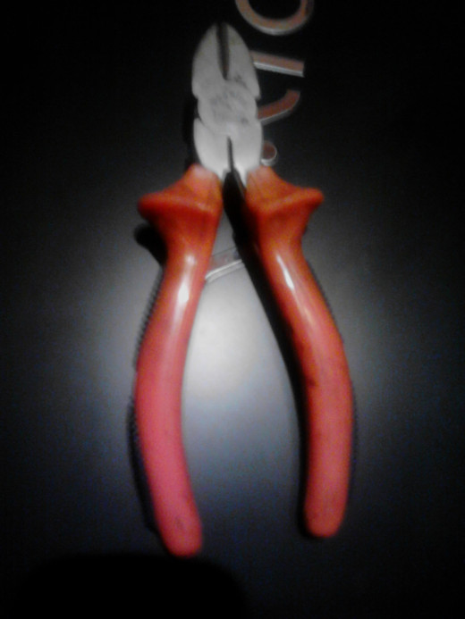 Now you need this device - I have no idea what the name in your country, let's say wire cutters device.