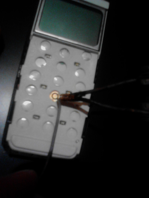 Go use solder wire and point the device on the exterior circle. ( don't use too much solder, no need to take you more than one second). 