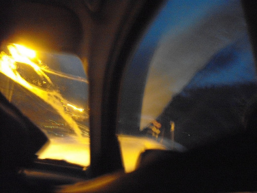 Sunlight reflecting in rear window of car
