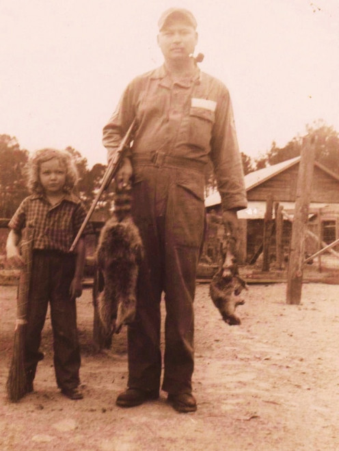 This is my father and myself on my grandmother's farm. Believe it or not those animals were meant for the table. As I look back on things, then I realize I actually ate things like squirrel, and raccoon among other things. 