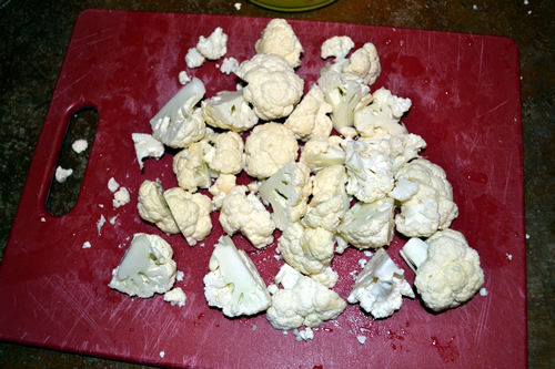 Cauliflower with stem removed, cut into pieces.