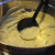 Ladle pancake batter Ladle pancake batter