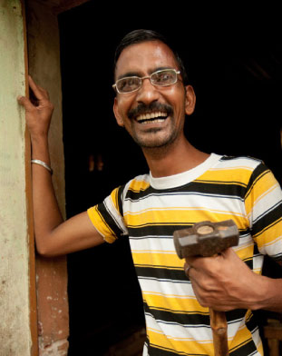 Carpenter who benefited from Warby Parker's Program 